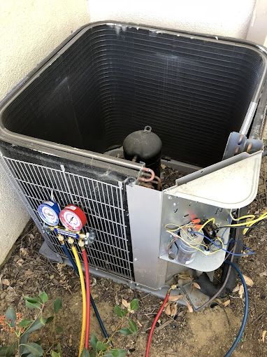 Outdoor air conditioning unit with gauges attached