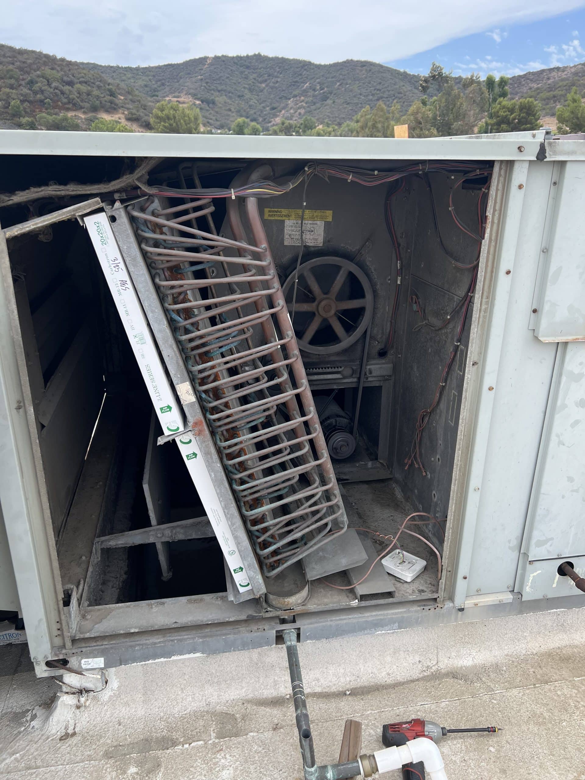 Open HVAC unit showing internal components.